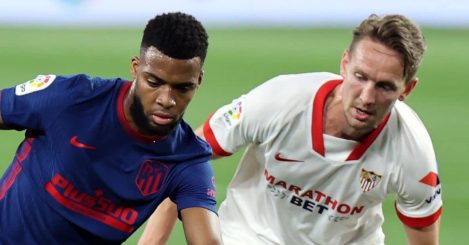 Thomas Lemar protects ball from Luuk De Jong in Sevilla v Atletico Madrid