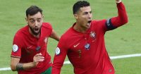 Portugal forwards Bruno Fernandes and Cristiano Ronaldo celebrate scoring a goal 2021